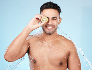 Image showing Skincare, beauty and water splash, man with kiwi for vitamin c facial detox for healthcare, natural healthy skin and smile. Water, wellness and sustainability, organic luxurycleaning and grooming.