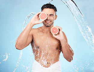 Image showing Skincare, beauty and water splash, man with fruit for vitamin c facial detox for healthcare, natural healthy skin and smile. Water, wellness and sustainability, organic luxurycleaning and grooming.