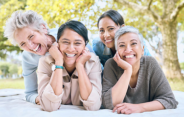 Image showing Senior women and friends portrait on picnic in park for bonding, wellness and relaxing lifestyle. Happiness, joy and smile of elderly retirement people in interracial friendship in nature together.