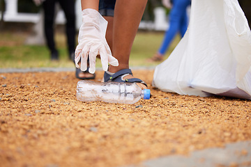 Image showing Volunteer hands, bottle and woman cleaning garbage, pollution or trash waste for environment support. Community recycling, NGO charity and eco friendly people help with nature park plastic clean up