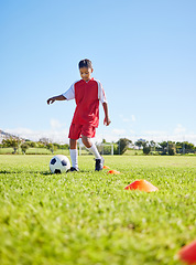 Image showing Football girl kid, grass and training for fitness, sports or balance with talent development, control or speed. Female child, fast football dribbling and exercise feet on field with strong mindset