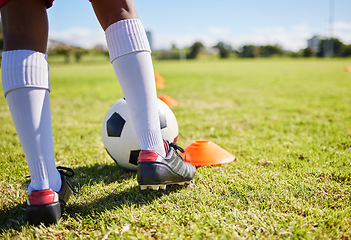 Image showing Closeup football kid, grass and training for fitness, sports and balance for control, speed and development. Young soccer player, fast dribbling or exercise feet on grass with cleats in low angle