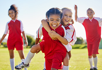 Image showing Soccer, girl celebration and field with happy piggyback, team building support and solidarity for winning game. Female kids, sports diversity and celebrate with friends, teamwork and goal in football