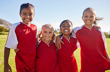 Image showing Girl, soccer group portrait and field with smile, team building happiness and solidarity for sport training. Female kids, sports diversity and happy with friends, teamwork and learning in football