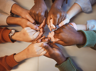 Image showing Holding hands, top view and group prayer of people with hope, support or faith, religion or spiritual praise. Community, teamwork and Christian friends, men and women praying together to worship God.