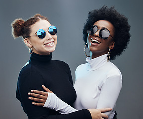 Image showing Fashion, futuristic and women smile in sunglasses, cyberpunk and trendy designer brand with gen z youth. Marketing, diversity and contemporary style with vision and edgy against studio background