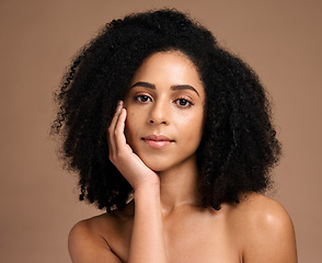 Image showing Beauty, black woman and hair care portrait for luxury hair cosmetics or skincare wellness in brown background studio. Young African model, healthy and natural waves hairstyle or dermatology treatment