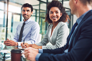 Image showing Meeting, collaboration or diversity and a business black woman in the boardroom with her corporate team. Teamwork, planning and strategy with a female employee writing in the office during a workshop