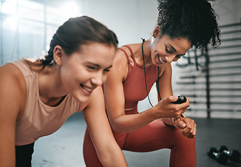 Image showing Fitness, smile and girl with a personal trainer for training, exercise time and performance monitor. Motivation, happy and friends helping with a gym workout and reading cardio results on stopwatch