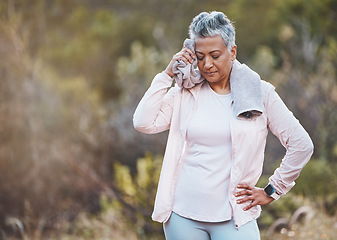 Image showing Senior woman, tired and towel for sweating at park after training or workout mock up. Sports fitness, break and fatigue, exhausted and elderly female wipe sweat with fabric after exercise outdoors.