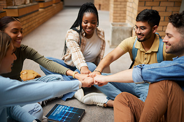 Image showing Teamwork, fist bump and hands of students in university for collaboration, unity and motivation. Support, solidarity and group of people and friends huddle for education goals, learning or targets.