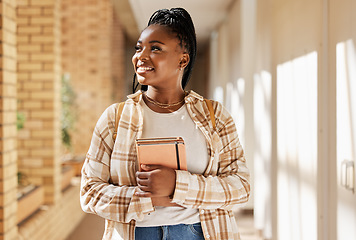 Image showing Black woman, college student and thinking about future with books while walking at campus or university. Young gen z female happy about education, learning and choice to study at school building