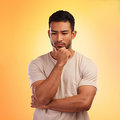 Image showing Thinking, sad and curious Asian man with a decision isolated on a yellow background in a studio. Depression, mental health and depressed Japanese person with a problem, choice or idea on a backdrop