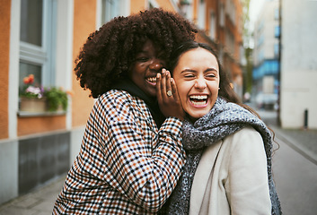 Image showing Friends, gossip in ear and women in street laughing at secret joke in city with smile on face. Urban secrets, rumor and whisper in ears, black woman with friend laugh at funny story on walk in town.