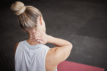 Image showing Neck pain, fitness and woman with injury in a gym after intense physical training or exercise. Medical emergency, sports accident and female athlete with sore, ache and swollen muscle in sport center