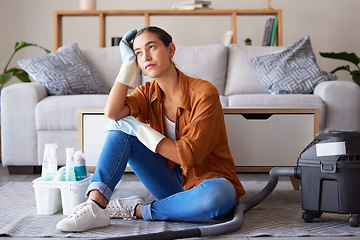 Image showing Tired, sad and woman cleaning home overwhelmed, stressed and moody thinking of tasks. Spring cleaning fatigue of young girl thoughtful in house living room with cleaner hygiene products