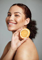 Image showing Woman, studio portrait and orange for skincare, health and wellness with cosmetic glow, self care and backdrop. Model, black woman and fruit for cosmetics, diet and healthy natural skin by background