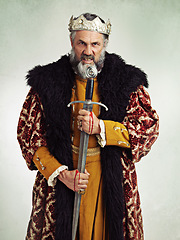 Image showing King, angry and portrait of man with sword in studio isolated on a gray background. Victorian royalty, evil and mad senior male, annoyed ruler and frustrated leader holding bloody blade after battle.