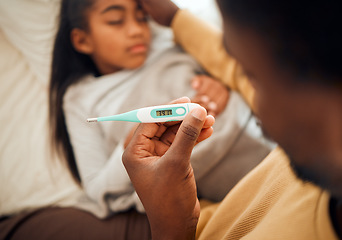 Image showing Child, girl and dad checking thermometer for ill kid or daughter lying on a bed feeling sad. Support, care and parent in bedroom to help a worried child in pain with flu, cold or fever