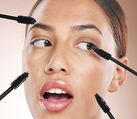 Image showing Woman, studio and makeup brush for mascara, beauty and eyes with wellness, skin glow or wow by backdrop. Model, black woman and eye brushes for skincare cosmetics, lashes or surprise for aesthetic
