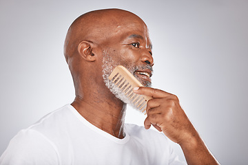 Image showing Elderly, black man with comb for beard, beauty and grooming with hygiene and cosmetic care against studio background. Hair care mockup, brush body hair and face with hair treatment and cosmetics