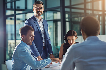 Image showing Business people, office and meeting for strategy, planning and success with teamwork, vision and leader. Businessman, leadership and group at desk with woman, black man and documents for innovation