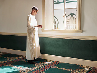 Image showing Muslim, prayer or man in a mosque praying to Allah for spiritual mindfulness, support or wellness in Doha, Qatar. Religion, peace or Islamic person in temple to worship or praise God with gratitude