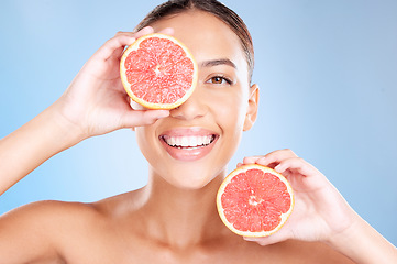 Image showing Beauty, grapefruit and woman with face and natural cosmetic care, facial and glow with vegan product against studio background. Skincare, healthy skin and wellness with fruit, hands and cosmetics.