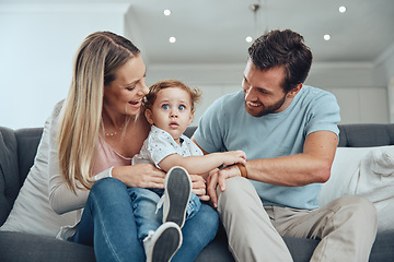 Image showing Happy family, kid and parents relax on living room sofa, couch and lounge for fun, quality time and bonding together at home. Smile, happiness and parents with love, care and joy for toddler child