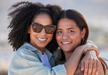 Image showing Women, lgbtq and happy beach portrait for love, hug and care on summer holiday, vacation and rainbow pride. Gay, lesbian and young couple of friends relax at sea, ocean or outdoor happiness in nature