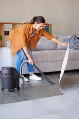 Image showing Cleaning, housekeeping and woman vacuum cleaner for floor in living room for dirt, dust and hygiene in home. Cleaning service, domestic housework and girl with electric appliance for lounge flooring