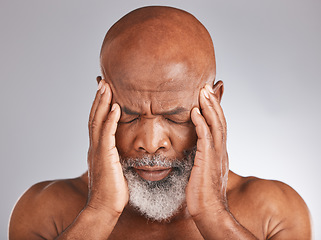 Image showing Elderly black man, headache and pain with hands and face, stress and mental health against studio background. Depression, skin and senior with healthcare problem, retirement and anxiety migraine