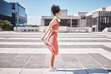 Image showing Fitness, city and woman stretching legs for health and wellness. Sports runner, training and female athlete warm up, prepare and getting ready for workout, exercise and running outdoors on street.