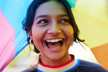 Image showing Rainbow, flag and lgbt with an indian woman in celebration of gay pride or human rights alone outdoor. Freedom, equality and lgbtq with a happy female outside celebrating her equality or inclusion