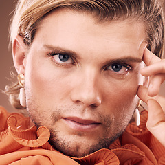 Image showing LGBTQ, fashion beauty portrait or man with orange clothes, natural facial makeup or creative style on background. Gay, transgender or gender neutral model with face cosmetics, skincare glow and pride