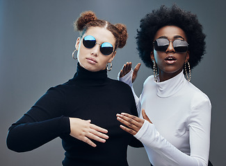 Image showing Fashion, women with sunglasses and futuristic with robotics, cyberpunk and trendy. Future design, females or girls with eyewear, gen z and marketing for tech development, fantasy or studio background