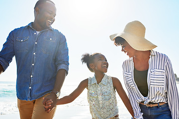 Image showing Black family, happy and walking on a beach with child or kid on vacation or holiday at the ocean or sea. Travel, sunshine and African parents relaxing with daughter holding hands together on a trip