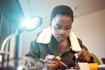 Image showing Black woman, student and engineer with electrical project while learning and studying. Education, engineering or technician at college with technology voltage meter for electricity and innovation