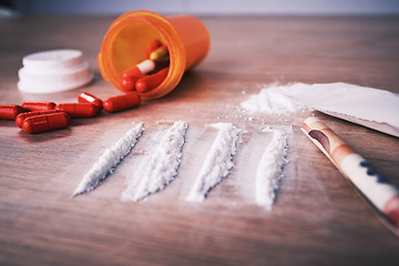 Image showing Drugs, addiction and cocaine on table with pills, social problem and crime in narcotics. White powder, mental health and rehabilitation to stop addictive substance abuse and trafficking illegal drug.