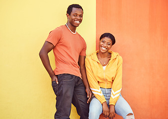 Image showing Black couple, smile and urban portrait by wall with edgy fashion, happy and bonding with color. Gen z, happy couple and city wall background with orange, yellow and love on adventure in Atlanta metro