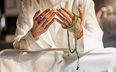 Image showing Hands, prayer beads and muslim man praying in mosque, temple or church. Islam, worship and islamic male with beads for worshiping Allah, God or holy spirit for hope, spiritual faith and religion.