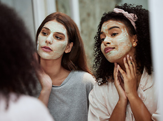 Image showing Women, home skincare or face mask bonding in house, bathroom or hotel for spa wellness, girls hospitality or healthcare grooming. Friends, people or beauty facial product for luxury wellness cleaning