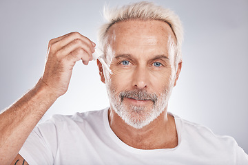 Image showing Senior man, facial portrait and oil skincare wellness, cosmetics beauty treatment and dermatology product in white studio background. Luxury spa, rich hyaluronic acid and face wrinkles serum dropper