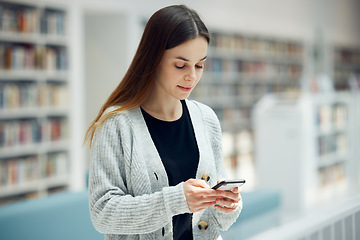 Image showing Smartphone, bookstore and woman typing a text message, reading blog or doing research on internet. Books, library and young student networking on social media or mobile app on cellphone at university