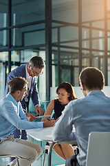 Image showing Man, tablet and business people in meeting for coaching, goals and mission at desk for discussion. Teamwork, woman and strategy for vision, collaboration or innovation in financial company with coach