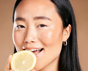 Image showing Asian woman, studio portrait and lemon for smile, healthy cosmetic glow on skin health by background. Japanese model, girl and beauty for vitamin c fruit, natural aesthetic or cosmetics for self love