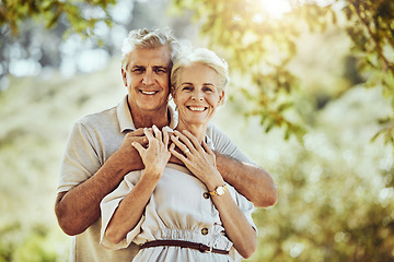 Image showing Elderly, couple with hug in park and love with marriage portrait, retirement travel together with commitment outdoor. Old man, woman and care with trust and support, nature mockup and happiness