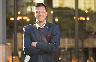 Image showing Businessman, smile and portrait in urban city standing crossed arms for success, positive mindset and happiness outdoor. Corporate man, happy and confident face for business achievement in cityscape