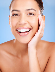 Image showing Face portrait, beauty skincare and woman in studio isolated on a blue background. Makeup, cosmetics and young female model with healthy, glowing and flawless skin after luxury spa facial treatment.