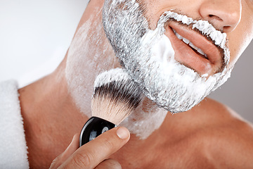 Image showing Closeup, man and brush for shaving cream in studio for self care, grooming and facial hygiene with smile. Model, beard and foam for shaving, self love and cleaning for beauty, zoom and skincare